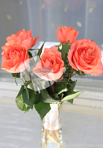 Image of Beautiful bouquet of roses in a glass vase 