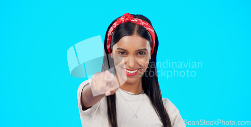 Image of Face, motivation and woman pointing to you, winner and promotion against blue studio background. Portrait female and lady with smile, show with finger or success with choice, opportunity or selection