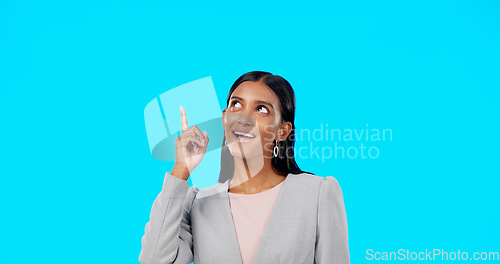 Image of Mock up, studio and happy woman point at business sales promo, present gift or discount deal mockup. Portrait, advertising space and marketing product placement for person isolated on blue background