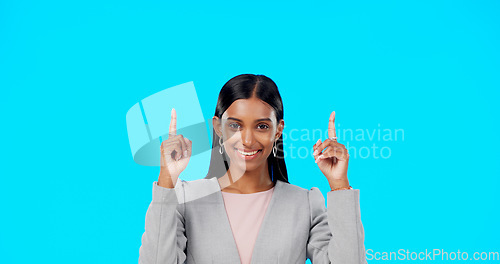 Image of Face, employee and Indian woman with motivation, direction and happiness against a blue studio background. Portrait, female entrepreneur or lady with decision, inspiration or choice with joy or smile