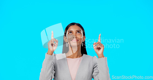 Image of Face, employee and Indian woman with motivation, direction and happiness against a blue studio background. Portrait, female entrepreneur or lady with decision, inspiration or choice with joy or smile