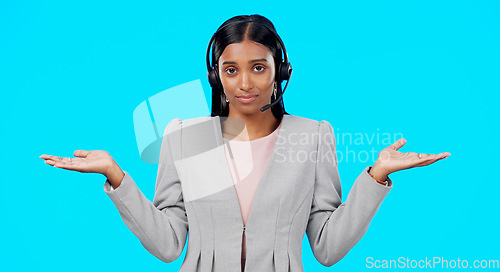 Image of Call center, portrait or woman confused with choice, doubt or opinions in studio isolated on blue background. Decisions, mockup space or Indian girl with confusion at telecom crm customer services