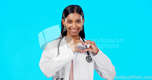 Image of Heart gesture, happy woman and medical doctor, surgeon or nurse care for support, medicine healthcare or cardiology health. Emoji love sign, studio portrait or hospital female help on blue background