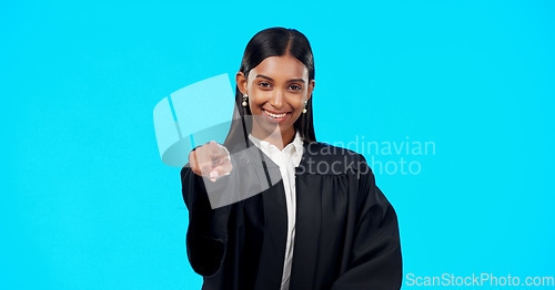 Image of Face, Indian woman and lawyer pointing to you, judge and legal proceeding against a blue studio background. Portrait, female employee and lady with mockup, attorney and show promotion with confidence
