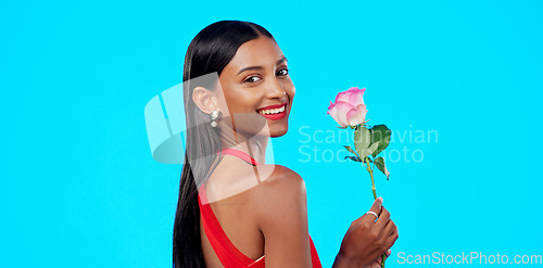 Image of Studio face, flower and beauty woman with nature plant, sustainable agriculture portrait and natural organic product. Eco friendly makeup, floral plant and skincare person portrait on blue background