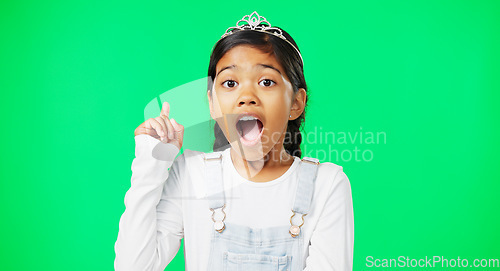 Image of Green screen, idea and portrait of surprised child feeling excited, happy and isolated in a studio background. Smart, clever and young girl or kid pointing up at brand, product placement or mockup