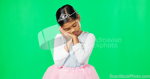 Image of Sleeping, tired gesture and child on green screen with crown, princess costume and tutu in studio. Sadness, sleepy mockup and isolated young girl with fatigued, dreaming and nap expression for rest