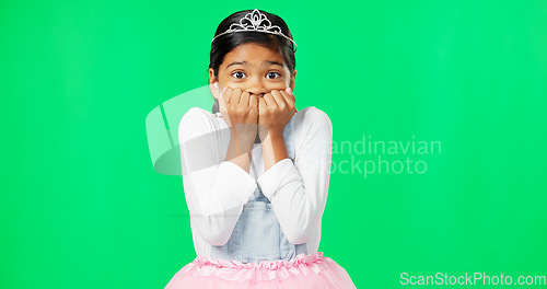 Image of Scared, fear and child with anxiety on green screen with crown, princess costume and tutu in studio. Stress, worry mockup and isolated young girl with worried, sadness and anxious facial expression
