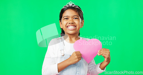 Image of Portrait, heart and emoji with a girl on a green screen background for the celebration of valentines day. Kids, happy and love with a cute little female child holding a cardboard shape on chromakey