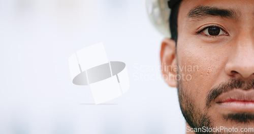 Image of Face of construction manager wearing hardhat while standing outside on site with copy space. Closeup of civil engineer worker doing maintenance and repair work for building project