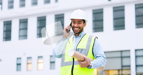 Image of Excited, confident and happy architect talking on phone, agreeing to building plan for office development in city. Cheerful, ambitious contractor or surveryor negotiating blueprint deal on technology