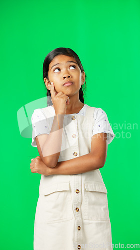 Image of Girl, child and thinking of idea on green screen background with mockup space for plan or choice. Indian kid portrait in vertical studio with hand on chin planning, think or brainstoming decision