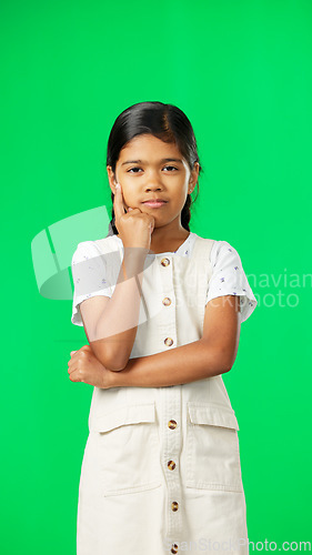 Image of Girl, child and thinking of idea on green screen background with mockup space for plan or choice. Indian kid portrait in vertical studio with hand on chin planning, think or brainstoming decision