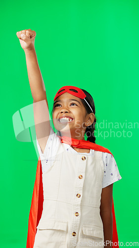 Image of Costume, face and child in a studio with green screen doing a superhero pose and outfit. Happy, smile and portrait of a girl kid from Mexico in cosplay clothes by a chroma key background with mockup.