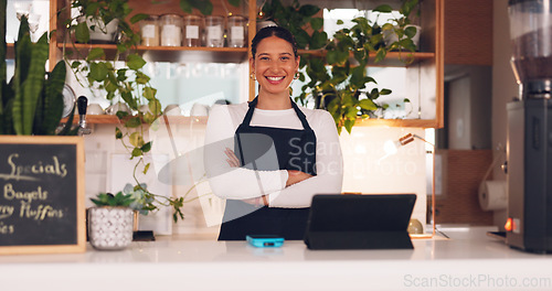 Image of Face, woman and barista with arms crossed, smile and confidence in store, success and waitress in cafe. Portrait, female employee or lady with happiness, entrepreneur or business owner in coffee shop