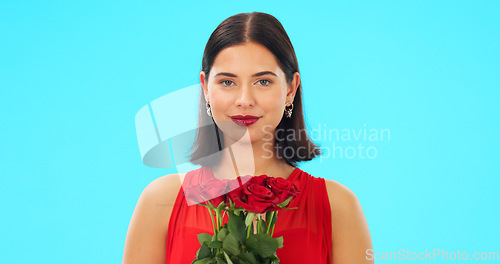 Image of Bouquet of flowers, happy woman and face in studio, blue background and color backdrop. Portrait female model, roses and smile for floral gift of love, celebration and romantic care on valentines day