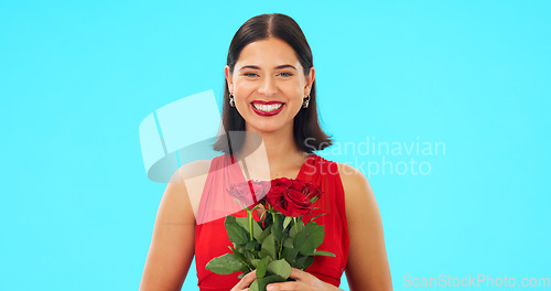 Image of Rose flowers, face and happy woman in studio, blue background and color backdrop. Portrait of female model, plant bouquet and floral gift for celebration of love, romantic present and valentines day