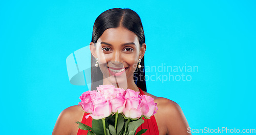 Image of Face, flower bouquet and happy beauty woman with nature gift, sustainable agriculture portrait or natural present. Eco friendly product, floral studio roses and female person smile on blue background