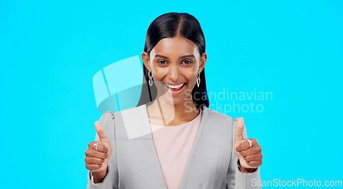 Image of Thumbs up, happy and studio woman with business emoji gesture for congratulations, job well done or winner satisfaction. Agreement, female portrait and person dancing with yes sign on blue background