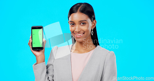 Image of Chroma key, green screen and portrait of businesswoman with phone for product placement, branding and mobile app advertising. Smile, happy and professional female isolated in a studio blue background