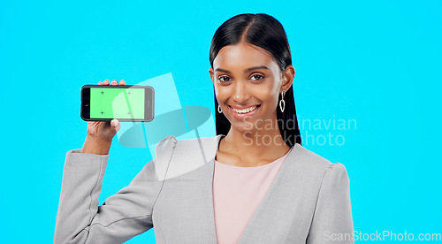 Image of Chroma key, green screen and businesswoman holding phone for product place, branding and mobile app advertising. Smile, happy and portrait of professional female isolated in a studio blue background
