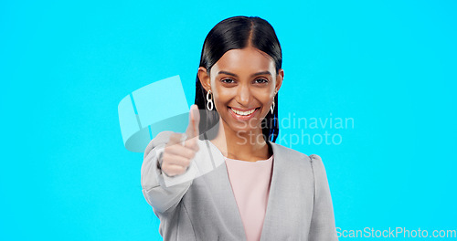 Image of Thumbs up, perfect and happy businesswoman doing accept hand gesture, sign or symbol with smile. Excited, agreement and portrait of female showing approval isolated in blue studio background