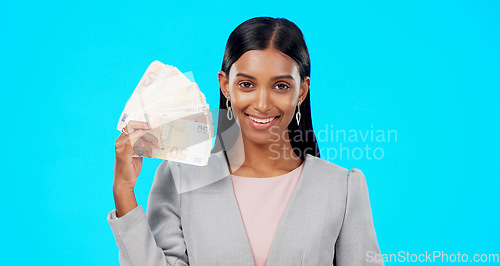 Image of Rich, portrait or excited Indian woman with money success on blue background in studio with smile. Wealthy, finance or happy girl with cash profit, lottery jackpot or euros by winning a bonus prize