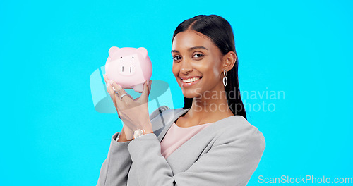 Image of Portrait, piggy bank or happy Indian woman with savings budget or financial profits growth on studio background. Smile, finance or excited girl holding financial tin for cash loan or money investment