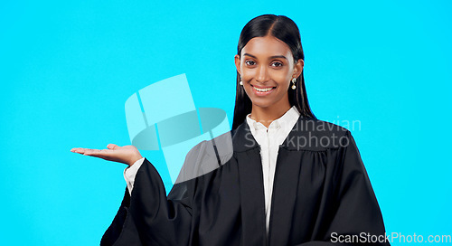 Image of Portrait mockup or woman lawyer in studio for product placement, advertising or marketing. News announcement space, legal job or Indian girl attorney showing promotion sales offer on blue background