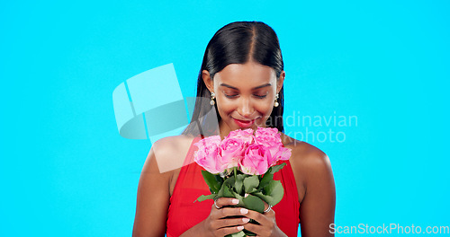 Image of Face, flower bouquet and happy beauty woman with nature gift, sustainable agriculture portrait or natural present. Eco friendly product, floral studio roses and female person smile on blue background