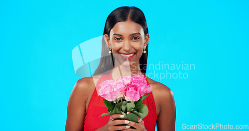 Image of Face, flower bouquet and happy beauty woman with nature gift, sustainable agriculture portrait or natural present. Eco friendly product, floral studio roses and female person smile on blue background