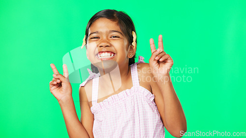 Image of Children, peace and the portrait of a girl on a green screen background in studio with a hand gesture. Kids, happy or emoji with an adorable and playful little female child on chromakey mockup