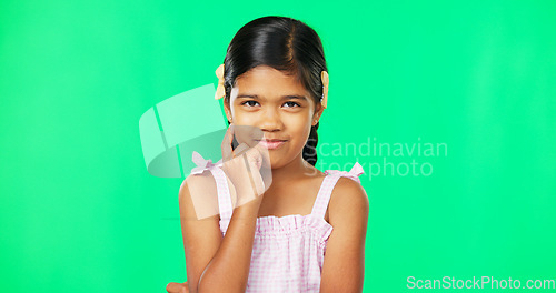Image of Thinking, green screen and idea by child with a question feeling excited, thoughtful and isolated in studio background. Planning, girl and joyful kid is happy, curious and planning expression