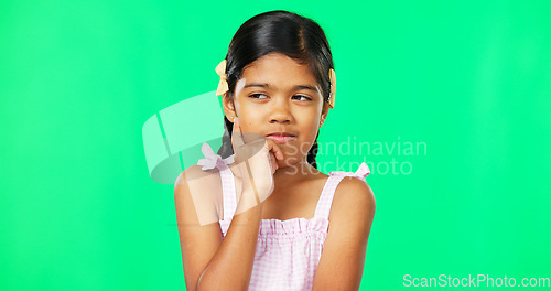 Image of Thinking, green screen and idea by child with a question feeling excited, thoughtful and isolated in studio background. Planning, girl and joyful kid is happy, curious and planning expression