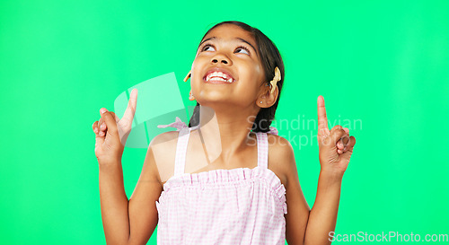 Image of Face, pointing and black girl with motivation, green screen and inspiration with joy, happiness and space. Portrait, African American female child or young person with gesture for direction or choice