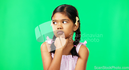 Image of Kid, eye roll and annoyed girl with a green screen in a studio feeling bored while thinking. Think, young child and casual fashion of a student waiting, tired and isolated with youth while frustrated