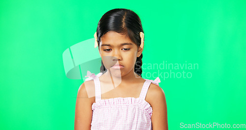 Image of Sad, depression and face of child on green screen with upset, disappointed and unhappy facial expression. Portrait, mockup studio and isolated young girl with sadness, problem and moody for attention