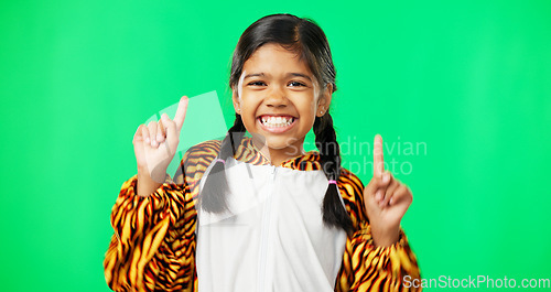 Image of Face, motivation and girl with green screen, pointing and happiness with joy, cheerful and inspiration. Portrait, young person and female child with direction, decision and options with choice or joy