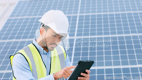 Image of Solar, electricity and construction being done by an engineer while using a tablet for research or planning. Portrait of one young engineer browsing on technology