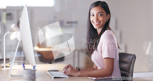 Image of Portrait of a female psychologist working online and making appointment notes in her calendar. One young professional therapist planning, checking and filing out medical information on her computer