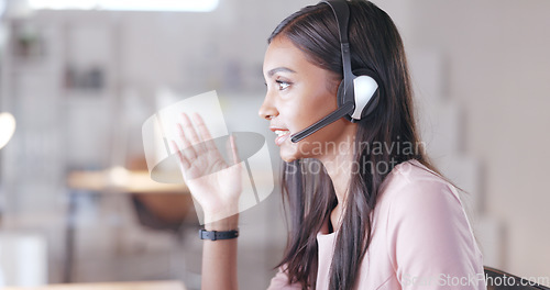 Image of Talking call centre agent wearing headset in office and promoting or marketing deals and sales to clients. Assertive and confident customer service operator helping, explaining and advising customers