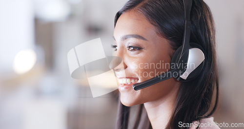 Image of Call center agent helping client in a phone call giving great customer service. Customer support employee consulting clients online using headset. Professional friendly woman working at her desk