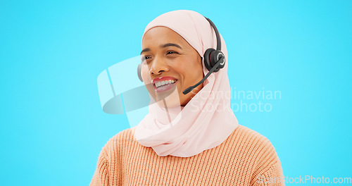 Image of Call center, talking and woman isolated on blue background agent, consultant or muslim telemarketing support. Happy telecom, global tech support or communication of hijab person speaking in studio