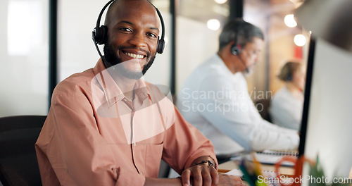 Image of Call center, customer support and face of a black man consultant doing online consultation in the office. Customer service, sales employee and telemarketing agent working on crm strategy in workplace
