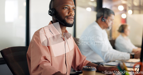 Image of Call center, customer support and face of a black man consultant doing online consultation in the office. Customer service, sales employee and telemarketing agent working on crm strategy in workplace