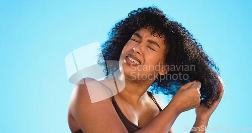 Image of Afro, smile and black woman with comb for hair on blue background for wellness, cosmetics and health shine. Beauty salon, hairdresser and happy face of girl brushing for hairstyle, grooming and care