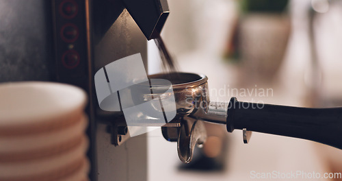 Image of Coffee machine, barista hand and grind beans in cafe, closeup and prepare latte or espresso drink with service. Hot beverage, person working in restaurant and brewing process, premium blend caffeine