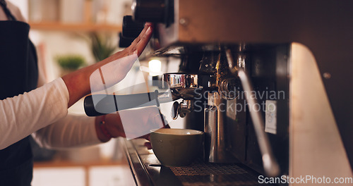 Image of Coffee machine, barista hands and woman in cafe, prepare latte or espresso drink with service and premium blend caffeine. Hot beverage, person working in restaurant and cup with brewing process