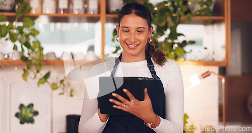 Image of Happy woman or barista on tablet for small business owner, social media update and startup sales promotion. Waitress or retail person laugh on digital technology for coffee shop or restaurant online