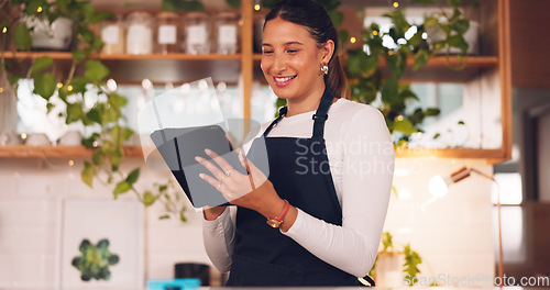 Image of Happy woman or barista on tablet for small business owner, social media update and startup sales promotion. Waitress or retail person laugh on digital technology for coffee shop or restaurant online